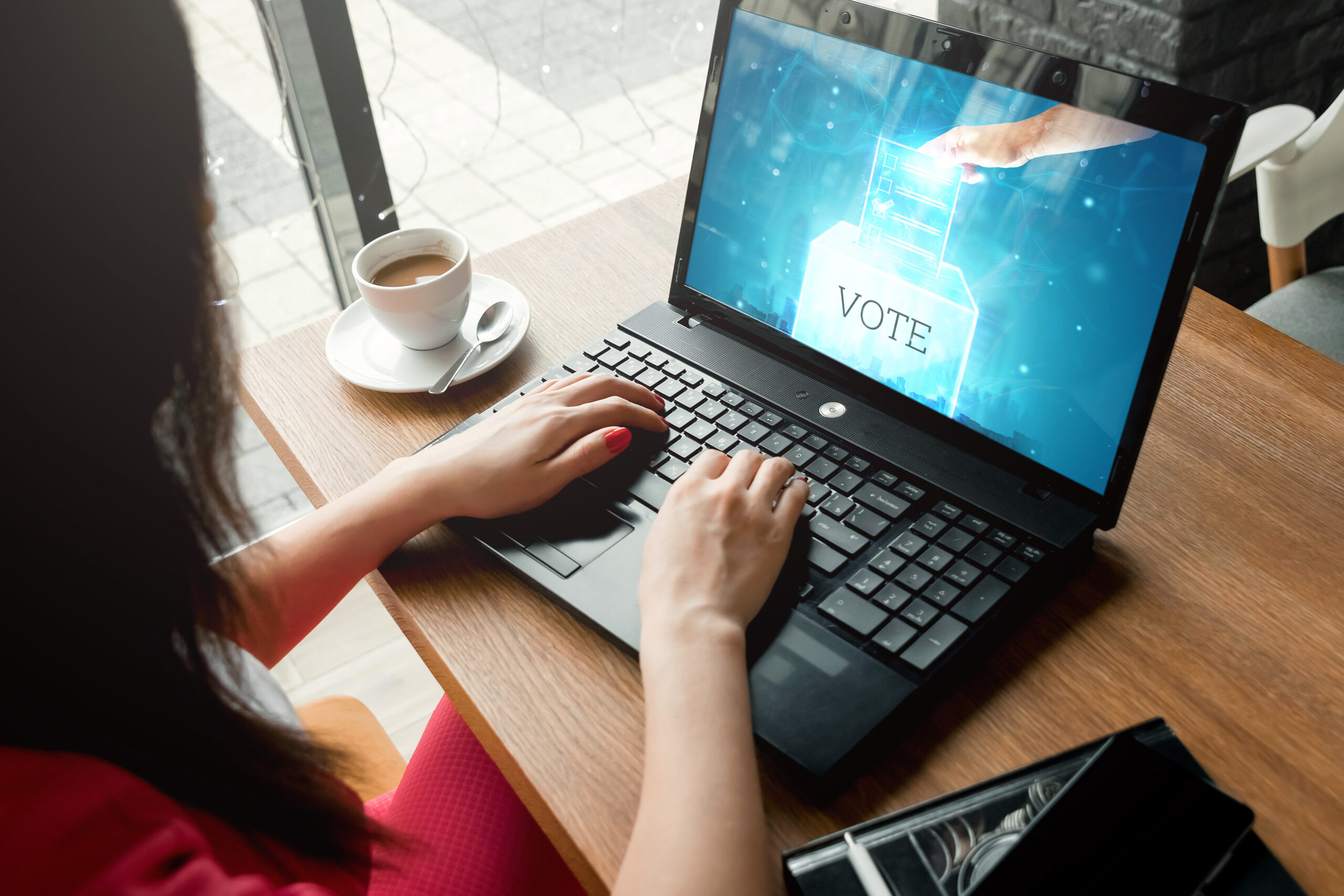 Picture of a woman typing on a computer 